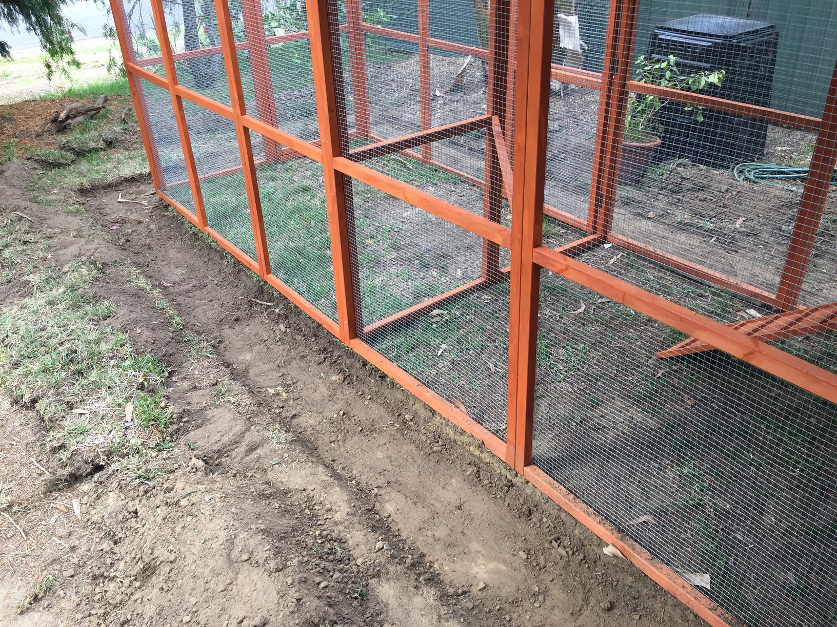 Another view of the shallow trench around the coop