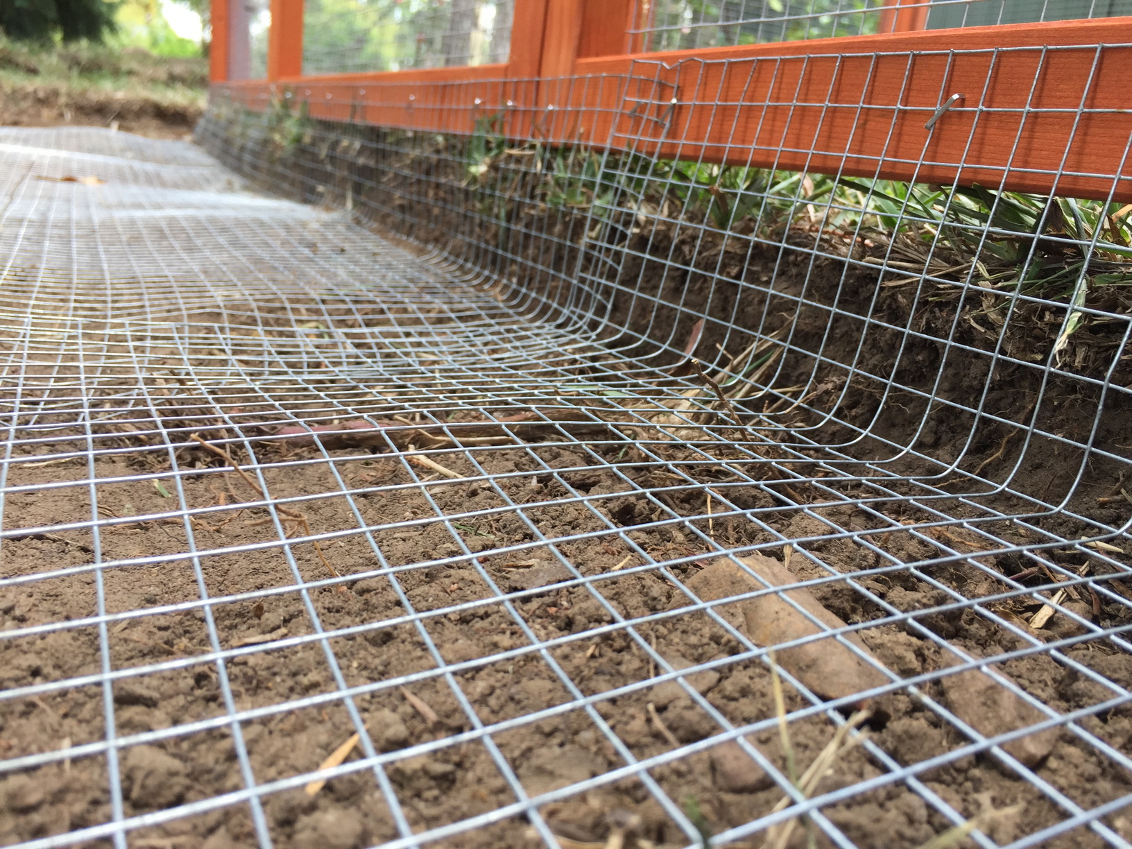 Close-up of the mesh flooring laid in the trench