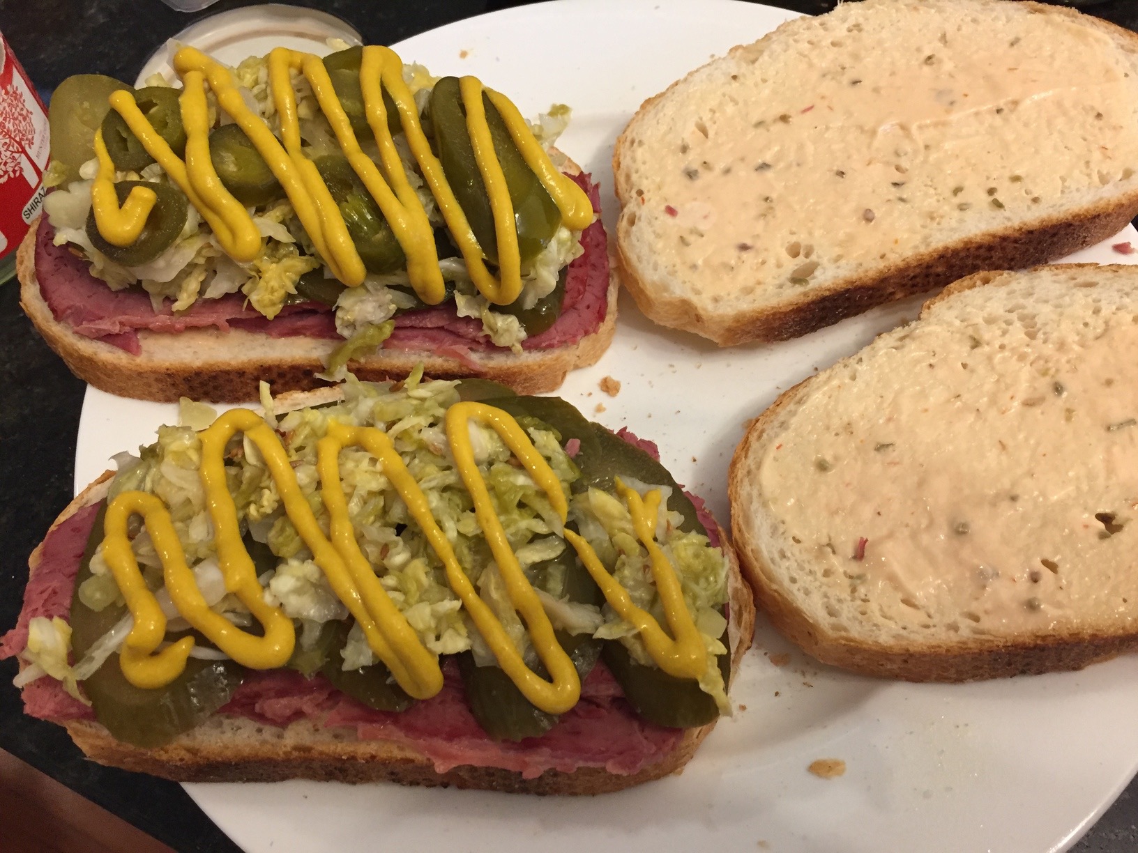 Reuben sandwiches with Russian dressing and American mustard, ready to be toasted. Mine has jalapenos on it because... jalapenos are awesome!