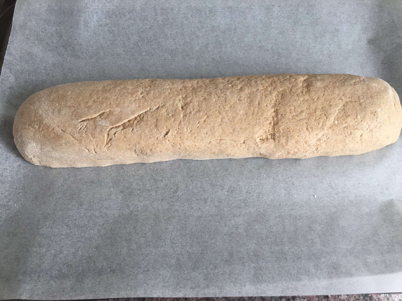 The dough shaped into a loaf to be left to prove