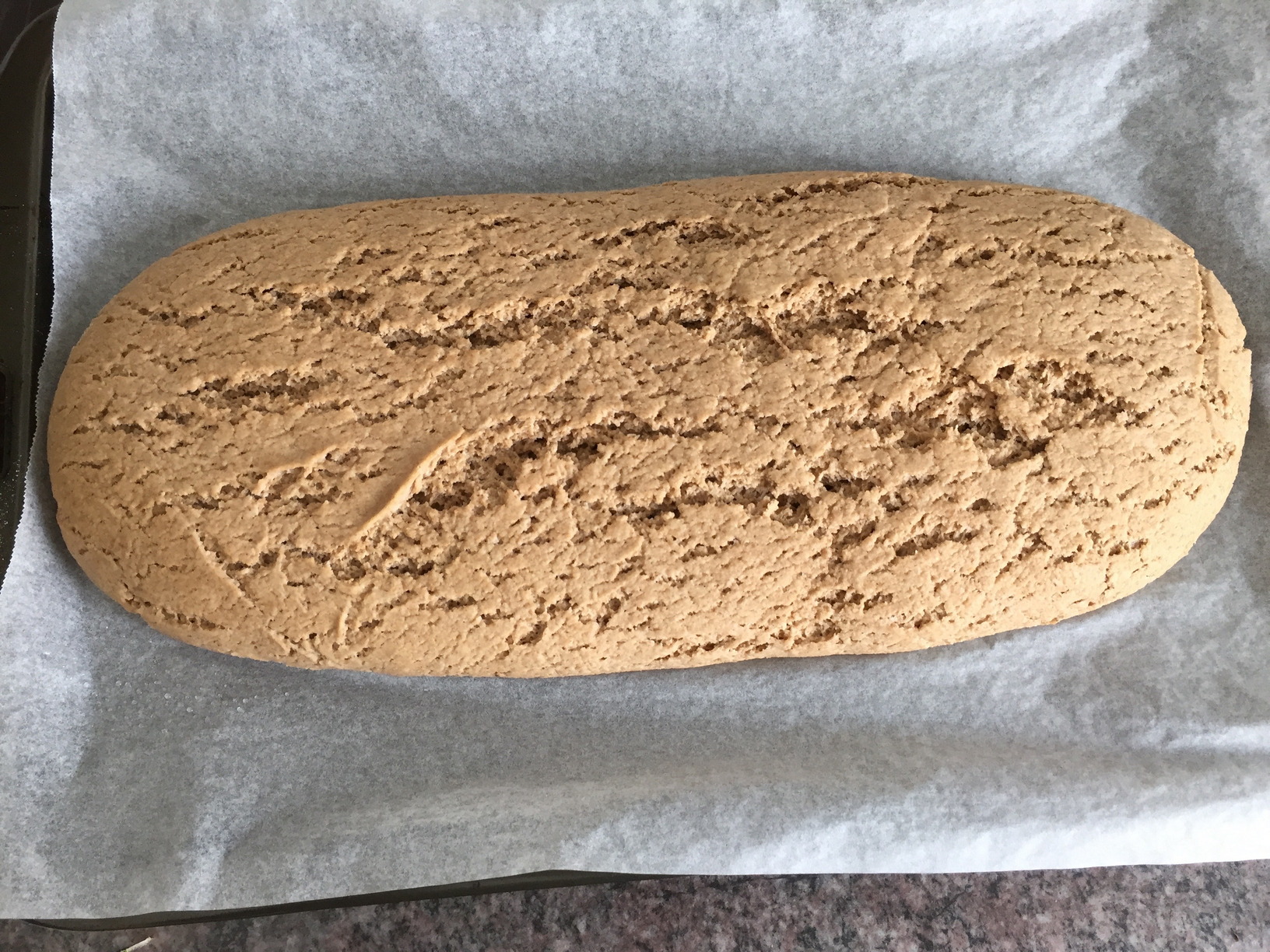 The proved loaf, 4 hours later, ready to bake. It spread a lot more than it rose.